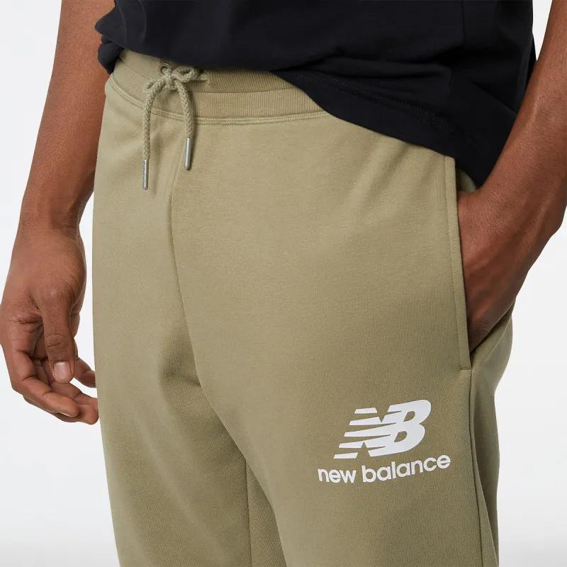 NEW BALANCE Pantaloni de trening NEW BALANCE Pantaloni de trening NB Essentials Stacked Logo Sweatpant 